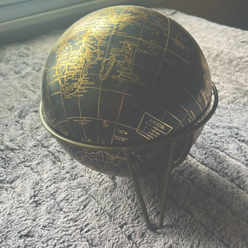 black and gold globe
